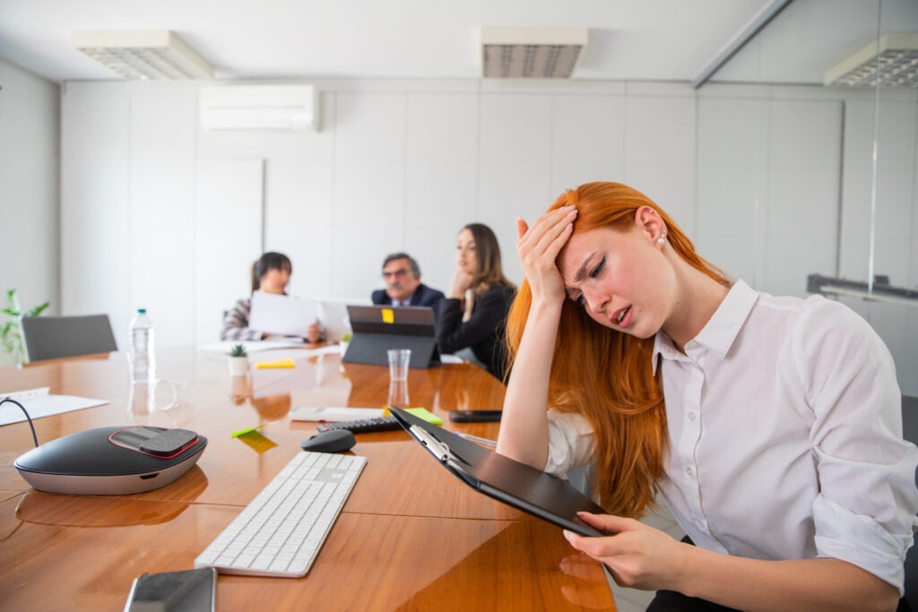 a stressed businesswoman at work touches her foreh 2023 11 27 05 21 11 utc